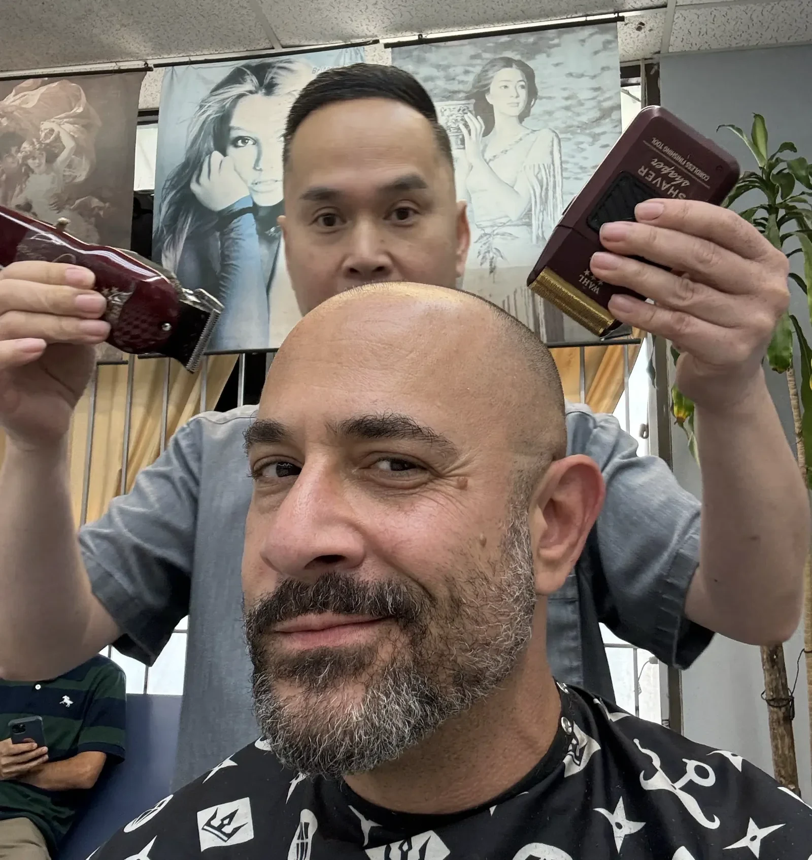 Omar Afra with barber Danny Truong in a later Texas Muslim photograph