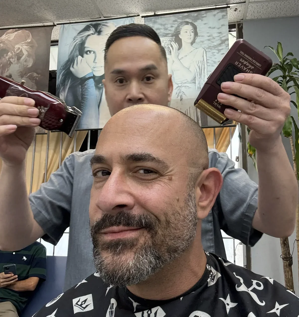 Omar Afra with barber Danny Truong at Bald Fade City
